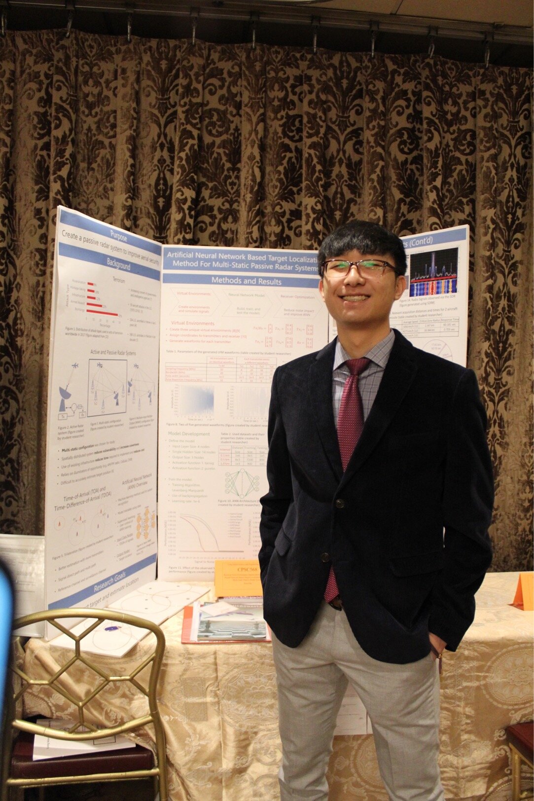 Sean Pak beside the research board at Intel ISEF.